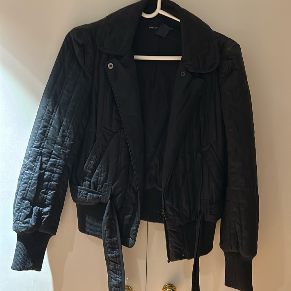 Navy bomber jacket with puffy shoulders and lower belt